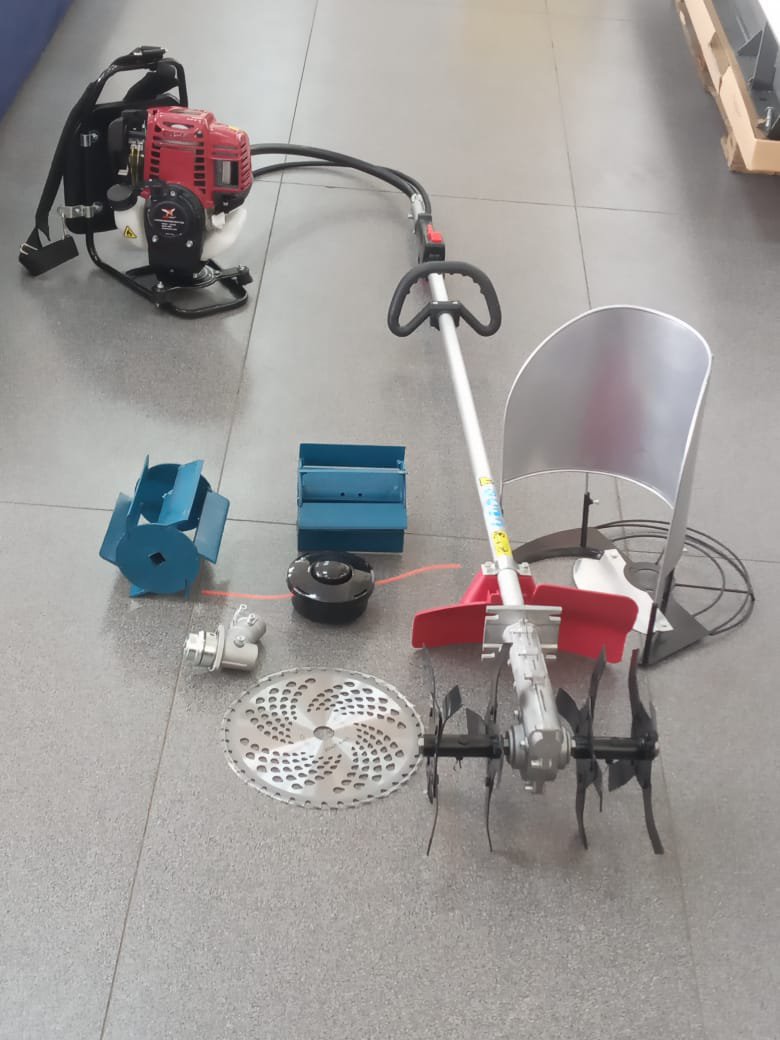 Petrol powered weeder tiller with a rice harvester